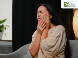 Patient in Sunnyvale performing guided TMJ jaw exercises during physical therapy session
